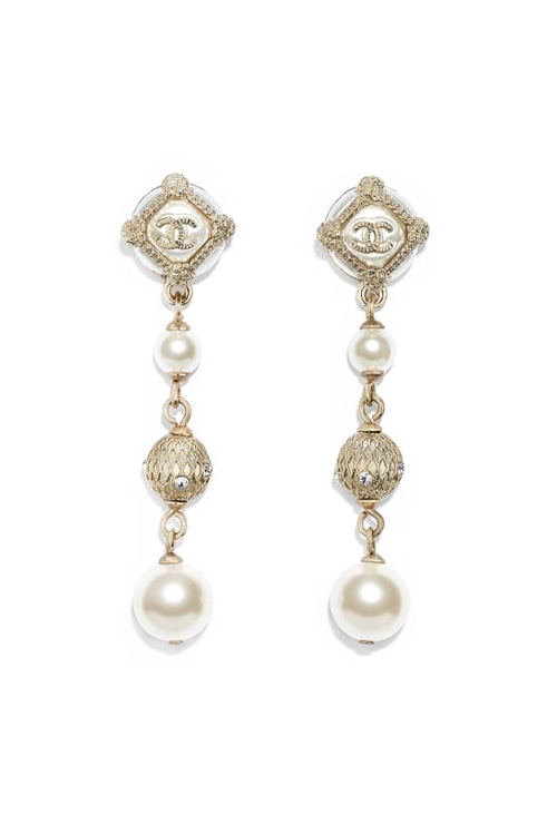 ethnic logo and pearl earrings